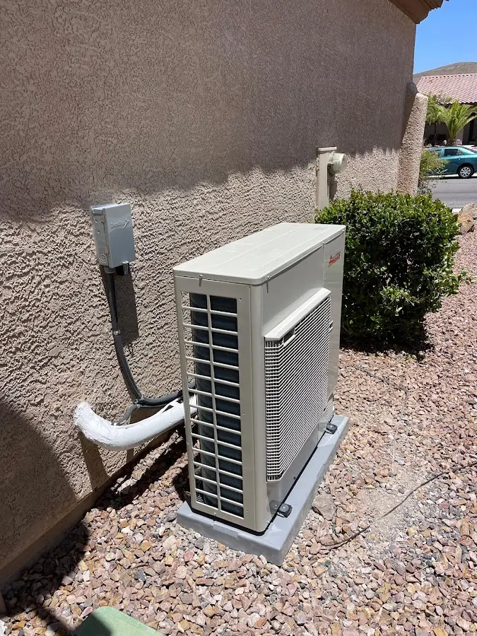 Residential air conditioning condenser unit in Gustine